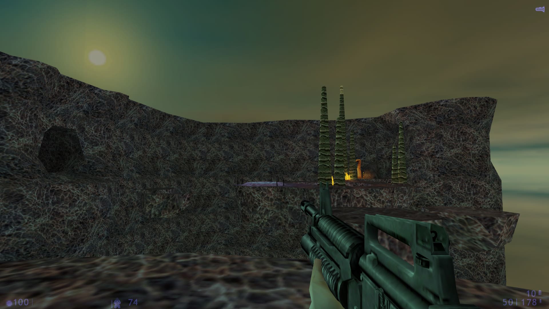 A screenshot from Half-Life: Blue Shift. A vista of Xen with a Sun-like solar object illuminating the floating rock formations.
