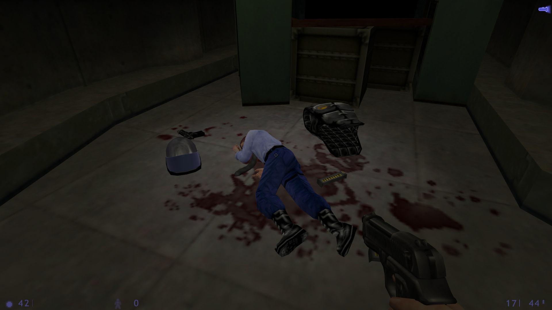 A screenshot from Half-Life: Blue Shift. The player stares at a dead security guard on the ground, with a vest, a helmet, a pistol and some ammunition lying around him.