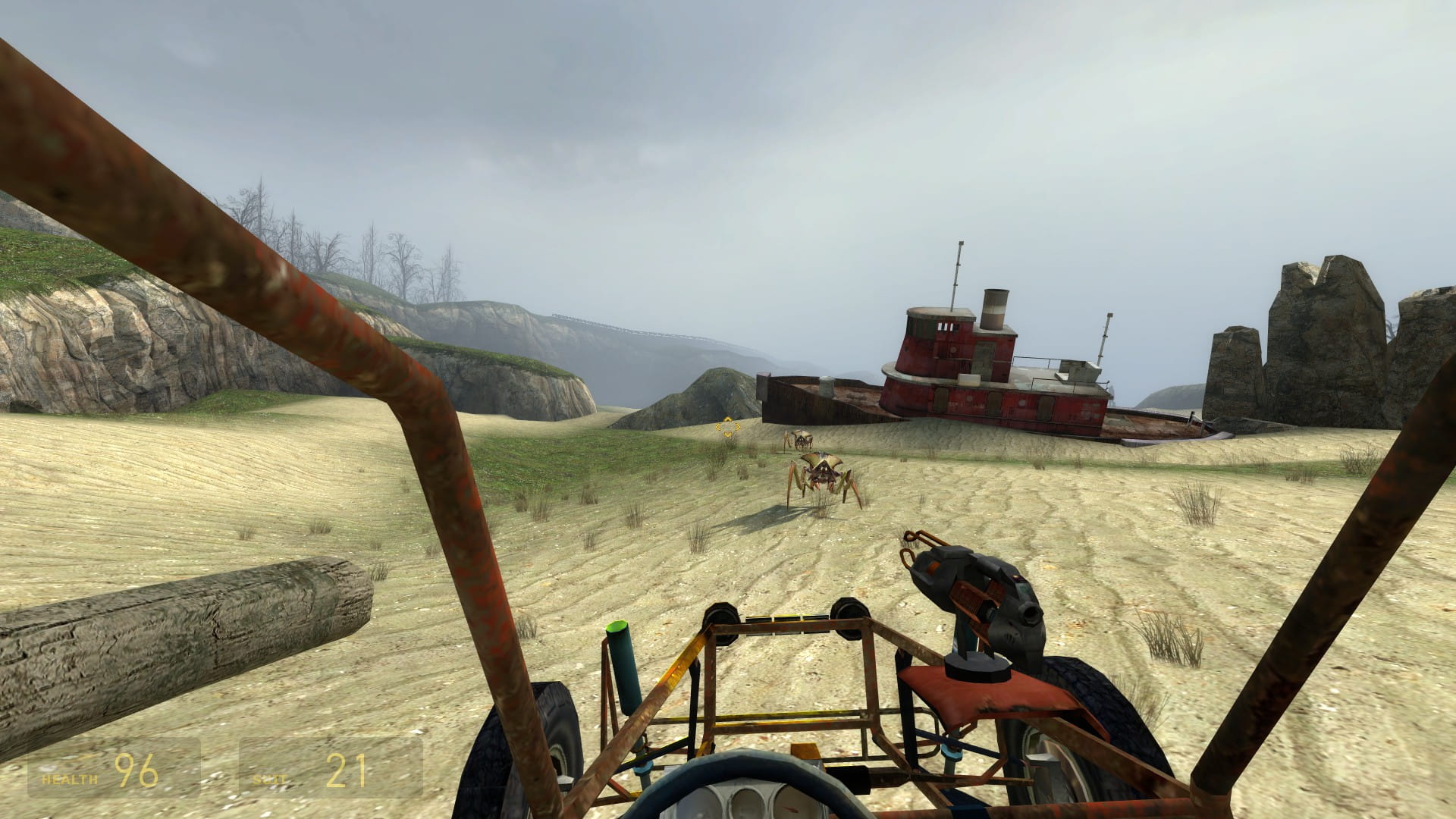 A screenshot from Half-Life 2. The player drives a buggy through the coast as antlions approach. In the background, an old ship stranded on land can be seen.