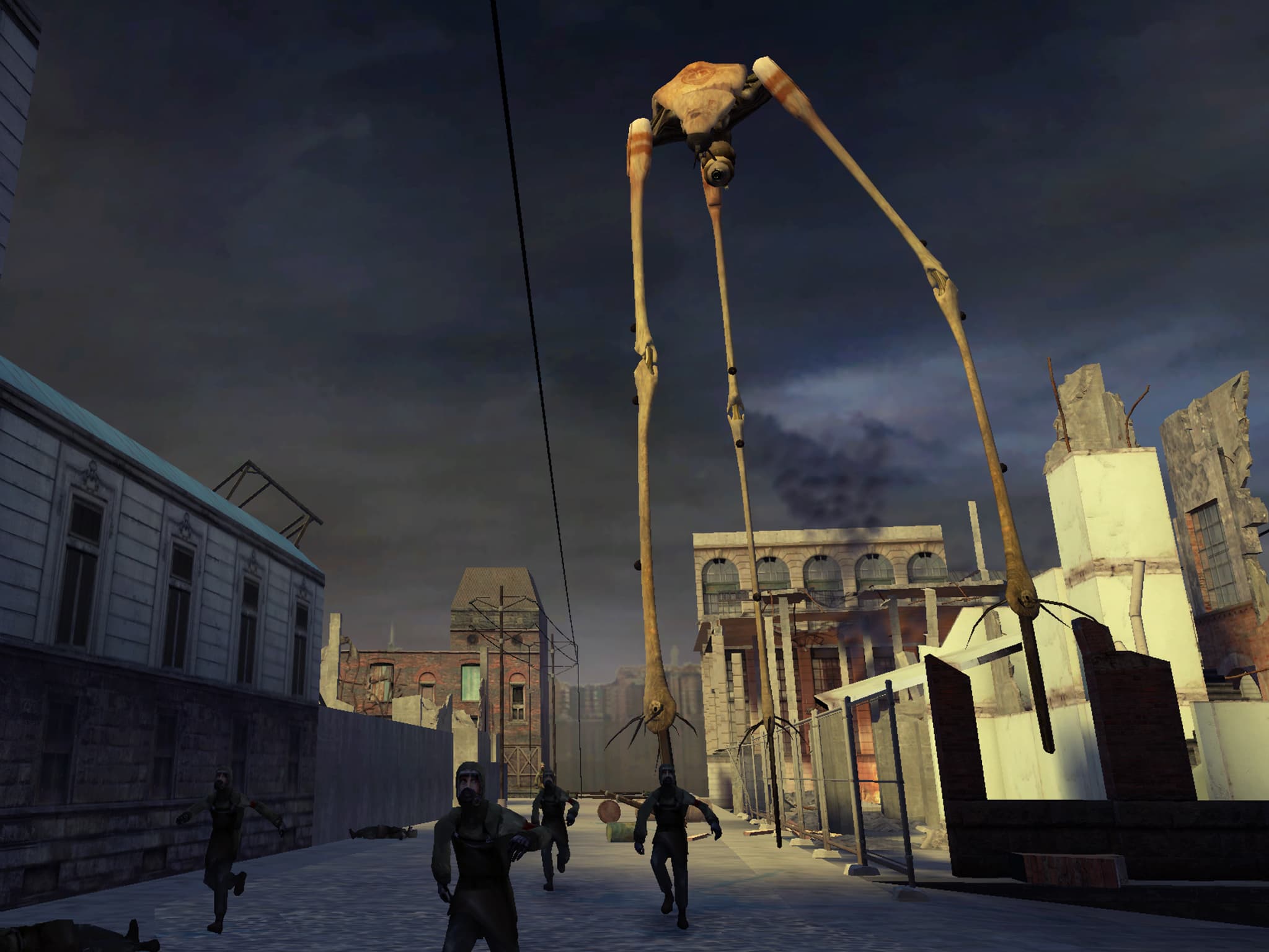 A massive tripod, the Combine Strider, chases after men wearing overalls and gas masks in the middle of a city block with dilapidated, war-torn buildings.