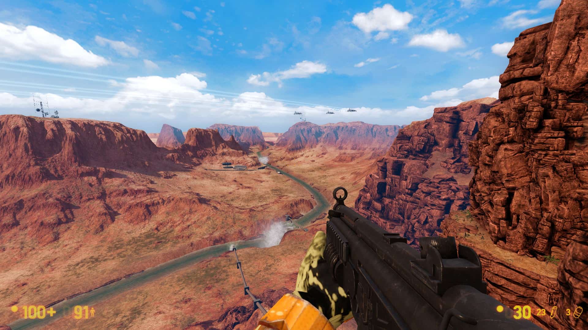 A screenshot from Black Mesa. The player, as Gordon Freeman, stares at the New Mexico vista as seen from the cliffs behind the Black Mesa research facility.
