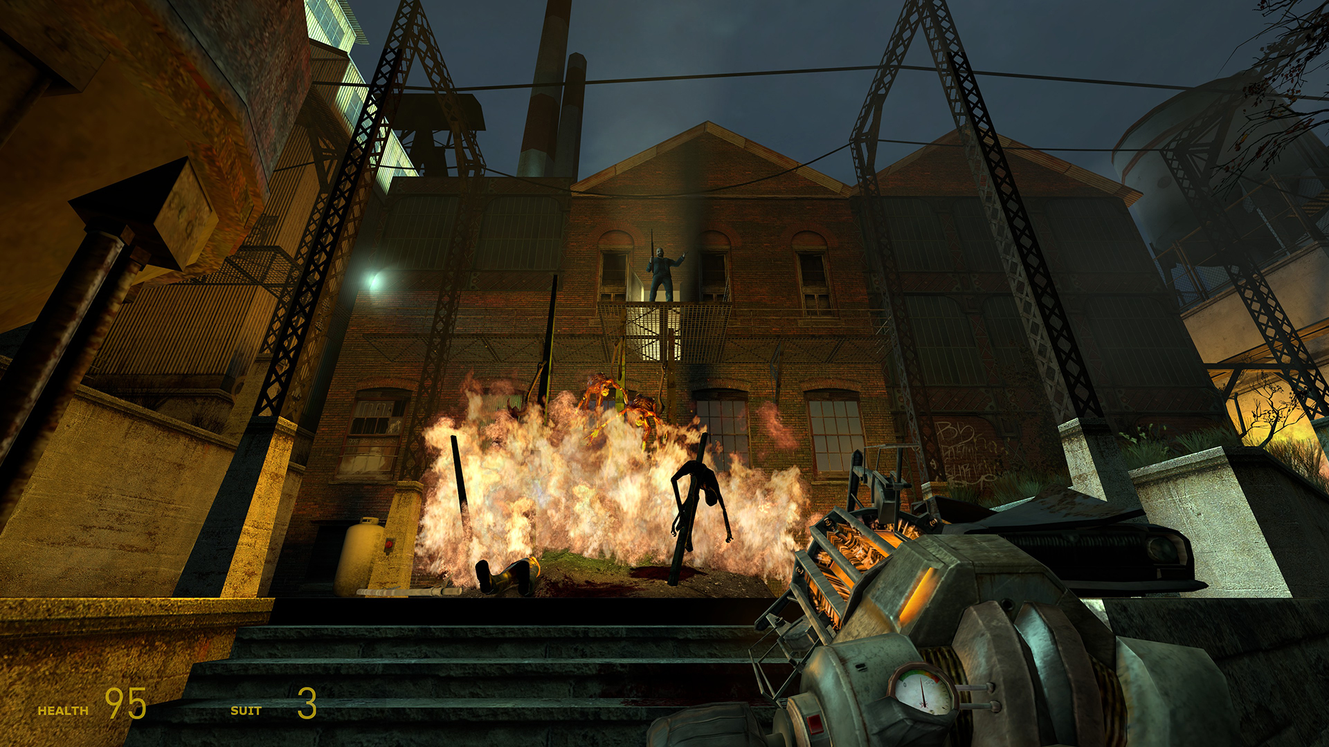 A screenshot of Half-Life 2. The player stares at a bonfire of zombie corpses in the plaza of Ravenholm as Father Grigori makes a speech above it.